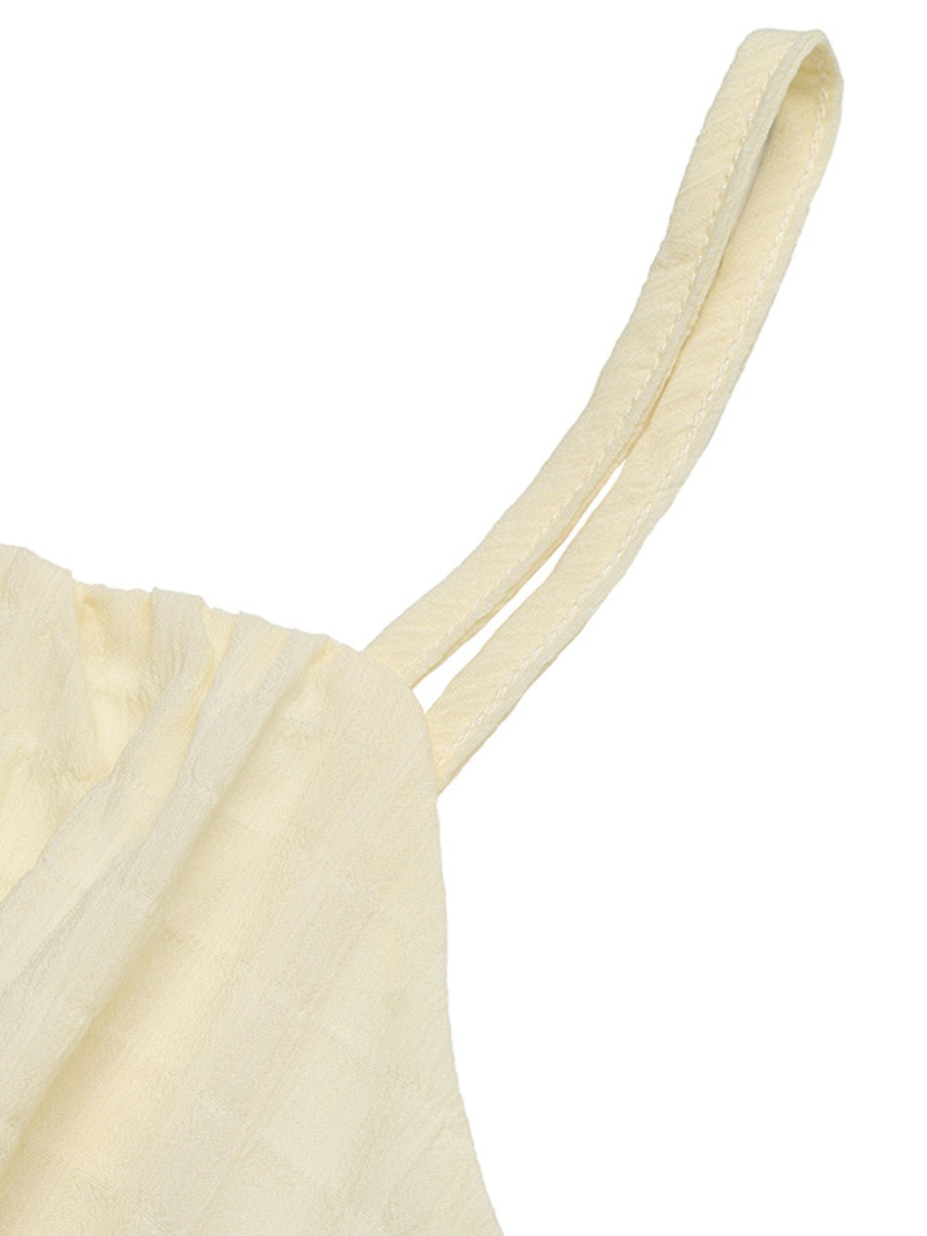 Cream smocked spaghetti-strap dress top with ruched detail and double-strap design.