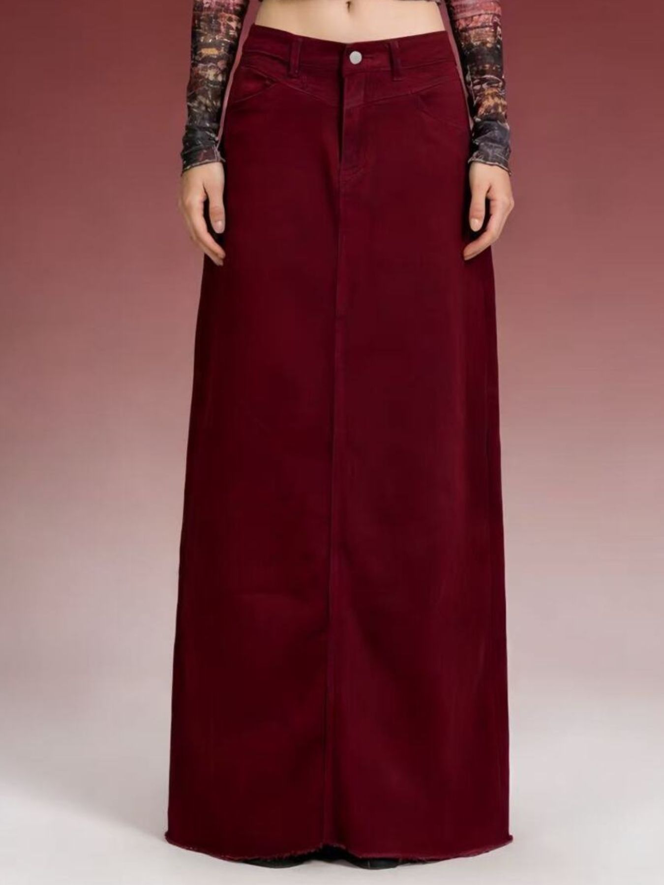 Raw-hem maxi denim skirt with front button closure in deep burgundy (85% cotton, 15% polyester).