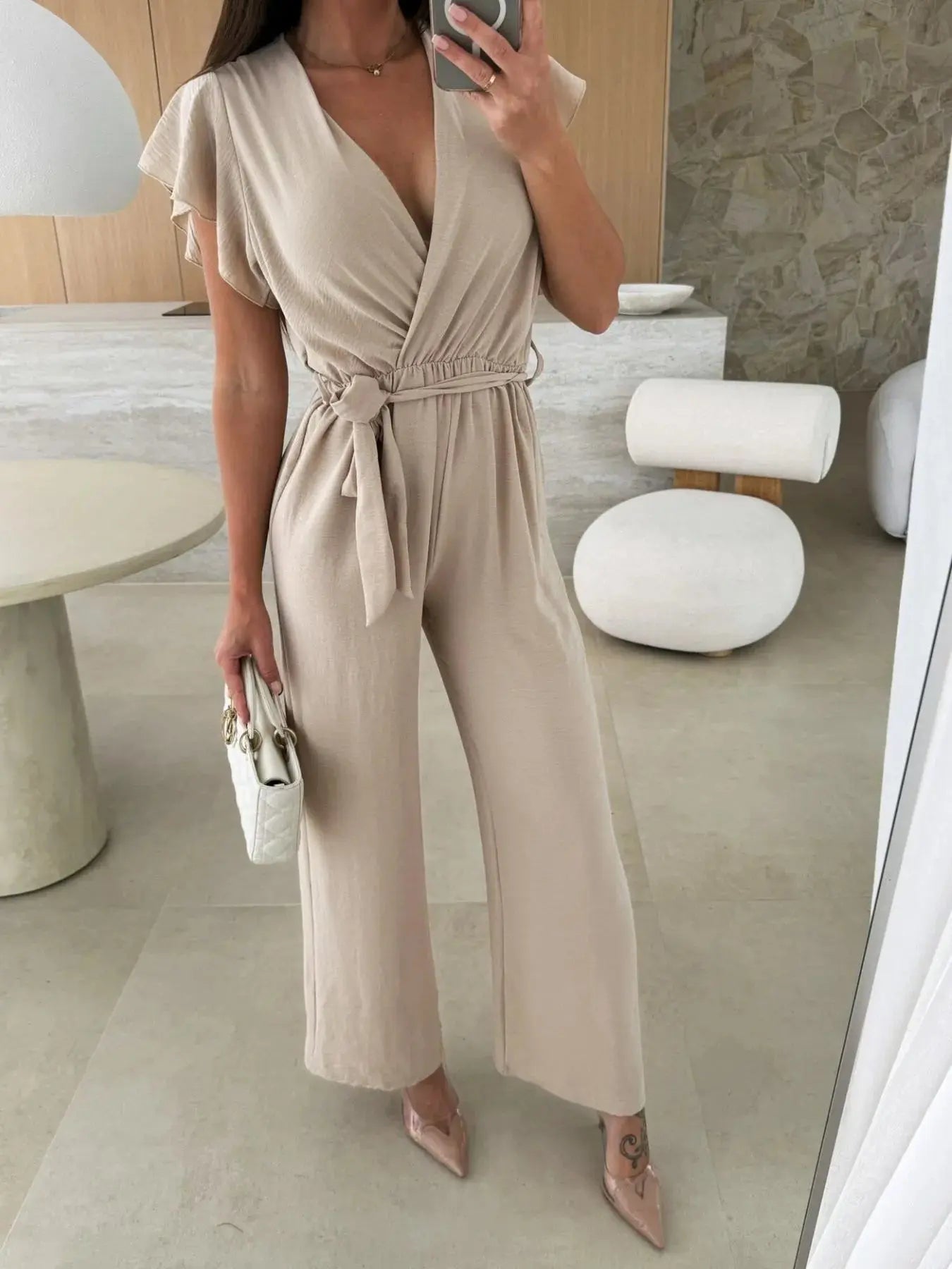 Surplice Wide Leg Belted Jumpsuit Trendsi