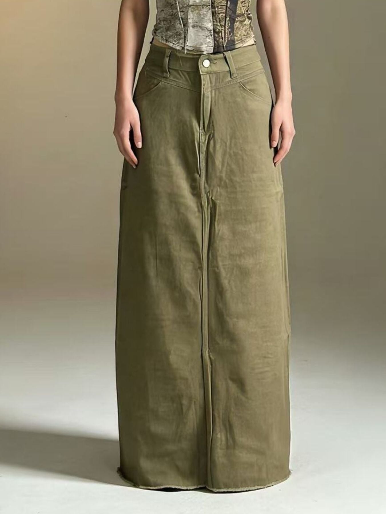 Olive raw-hem maxi denim skirt with front button closure; 85% cotton, 15% polyester.